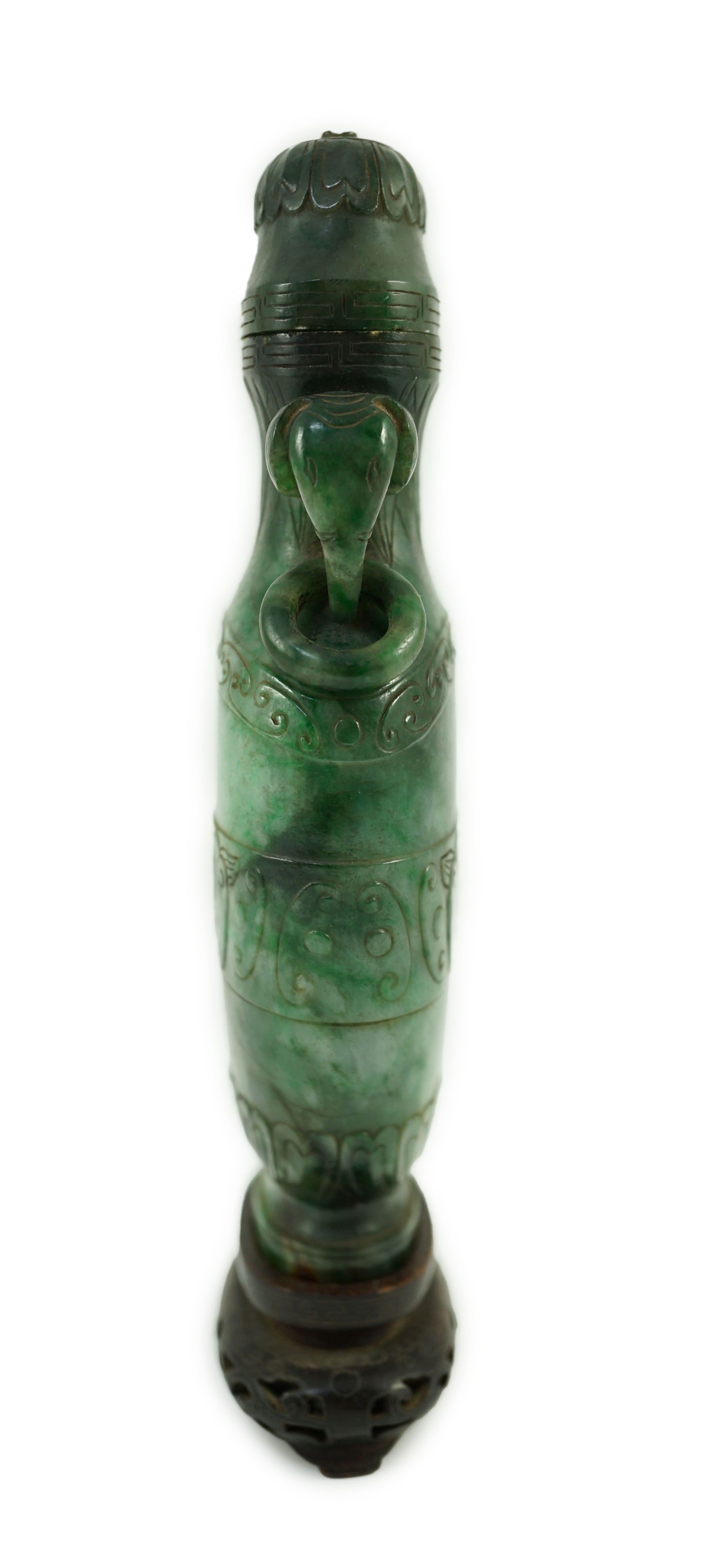 A Chinese archaistic green jadeite vase and cover, late Qing dynasty, 14.5 cm high, Silver wire inlaid wood stand, cover finial missing